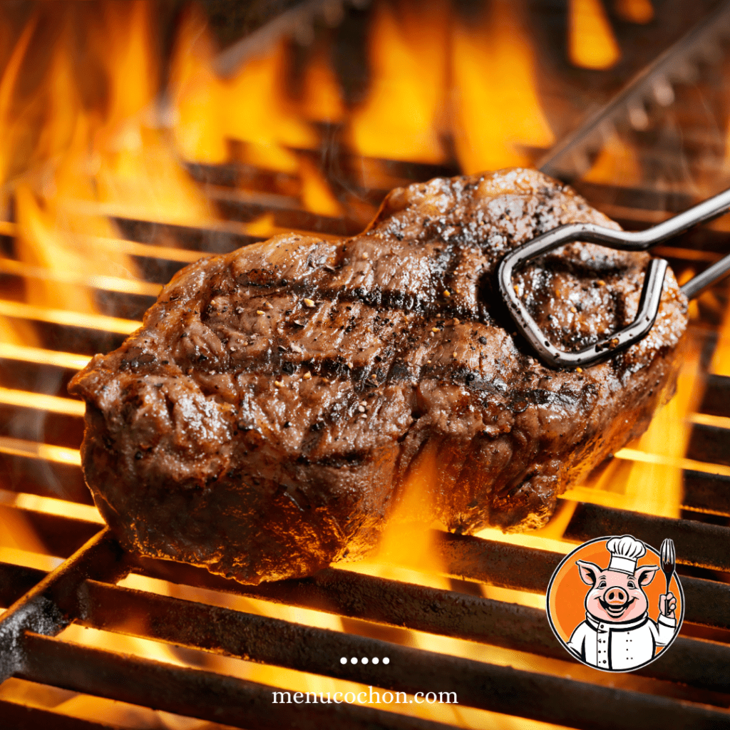 Steak grilled over open flames, barbecue.