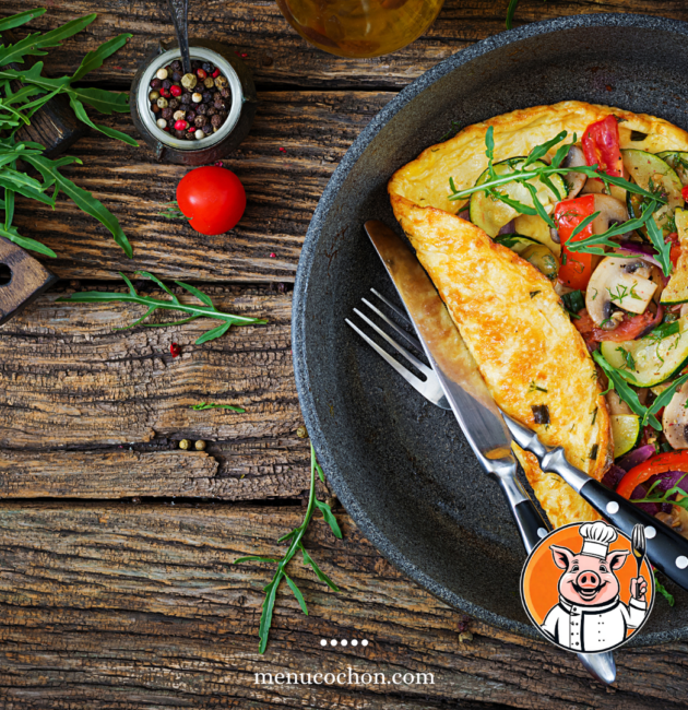 Omelette and vegetables in a cast-iron skillet.