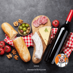 Cheese platter, charcuterie, wine, baguette, tomatoes.