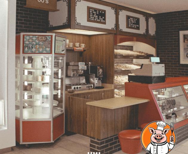 Vintage bakery interior with pig logo.