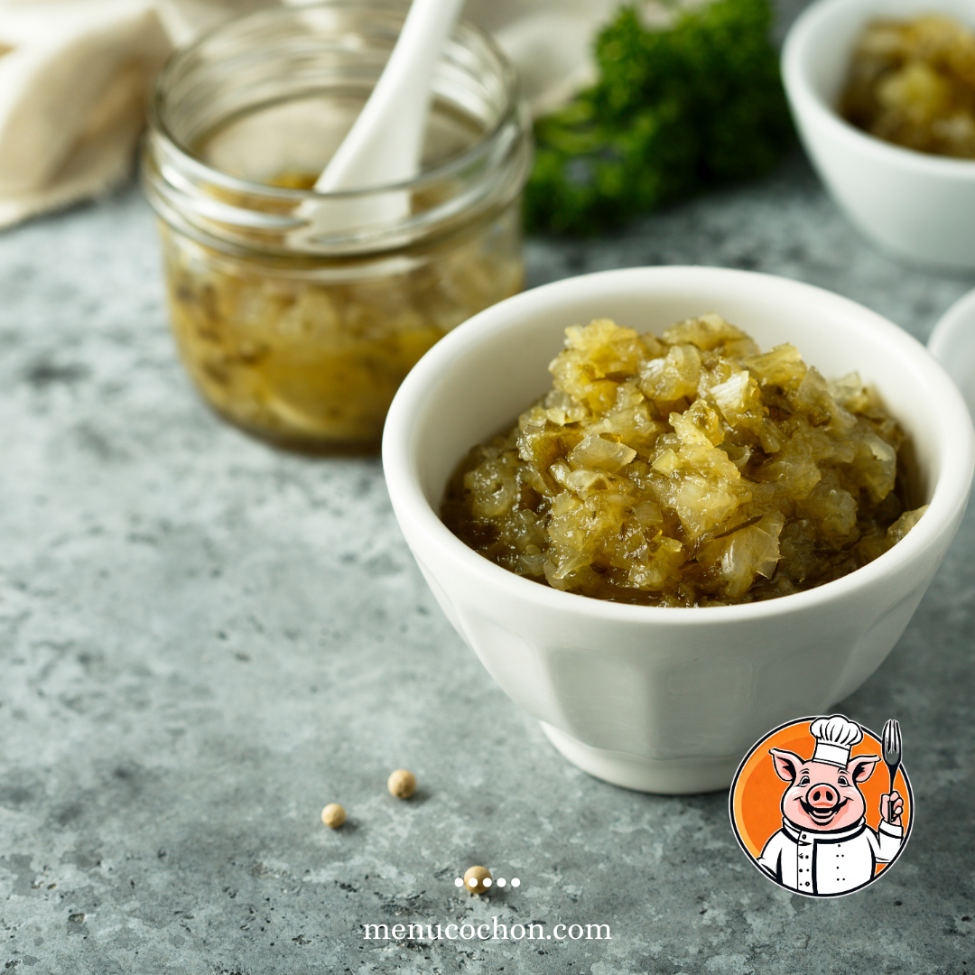 Homemade onion confit in a bowl on a textured base.